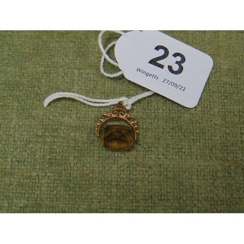 23 - 9ct gold watch chain fob with smoky quartz swivel stone. 3.2gms inc.