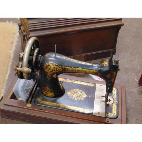 224 - Antique cased Singer sewing machine.