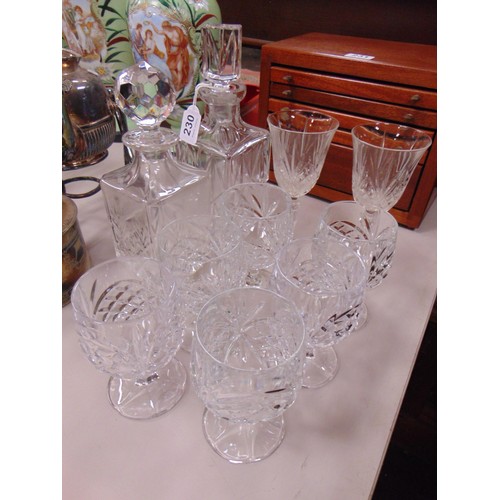 230 - Six cut glass goblets, two decanters and two wine glasses.