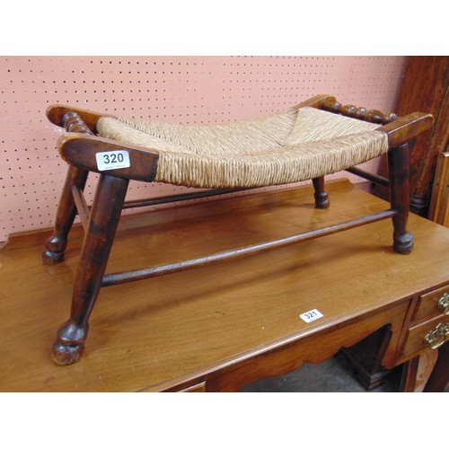 320 - Basket weave seated stool, of shaped form, on turned supports and stretchers. 12 x 26 x 12