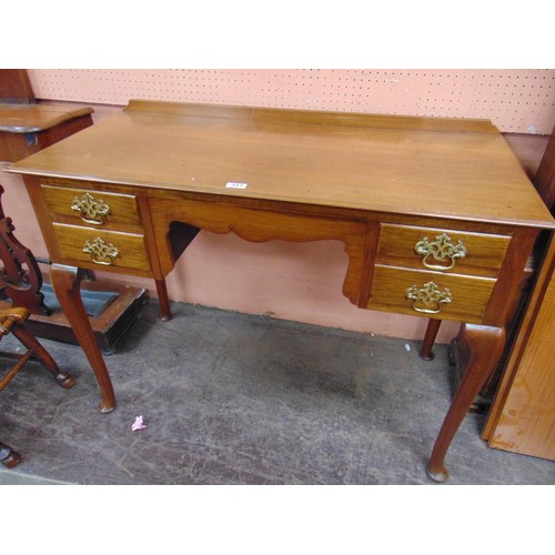 321 - Mahogany desk, raised back over two short drawers to either side with brass handles and escutcheons,... 