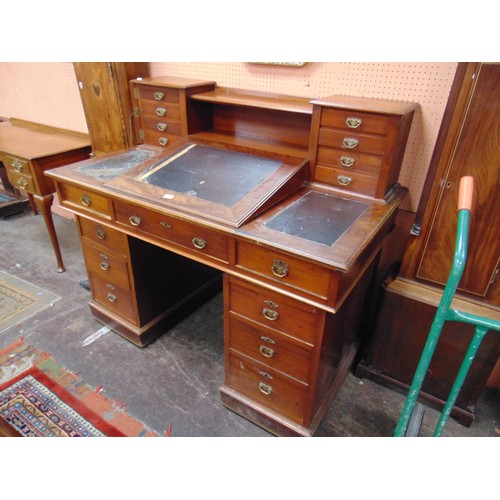 324 - Victorian mahogany clerk's desk. The stepped top having open recess, flanked by  four Wellington typ... 