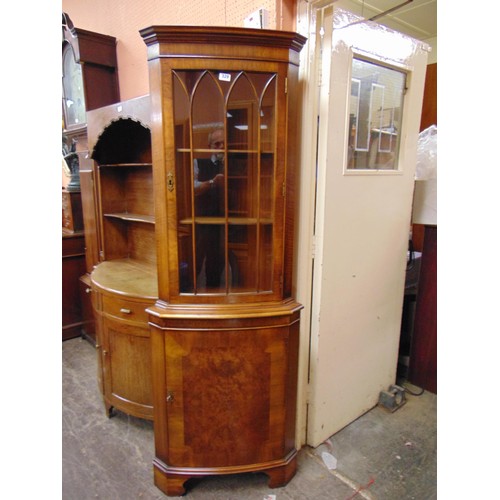 329 - Reproduction corner cupboard, glazed upper portion with single door to base. 71