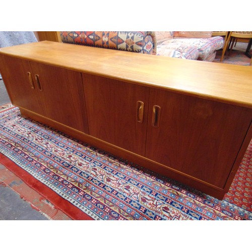 335 - G-Plan teak framed side board, having four cupboard doors. 21 x 64 x 18