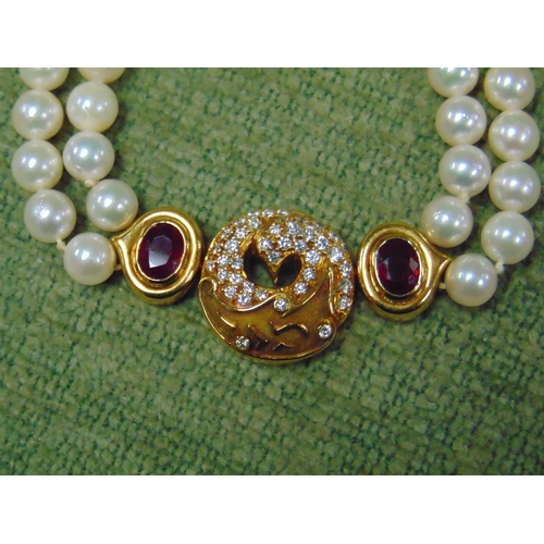 128 - A fine 18 ct gold Ruby , Diamond and pearl ''Phoenix'' choker by Boodle and Dunthorne.