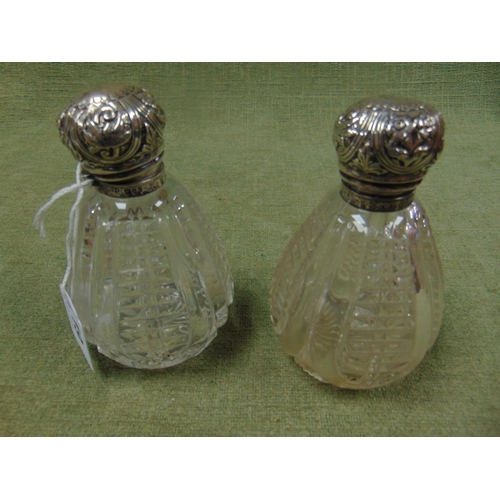 19 - Pair of antique silver topped scent bottles, London 1896