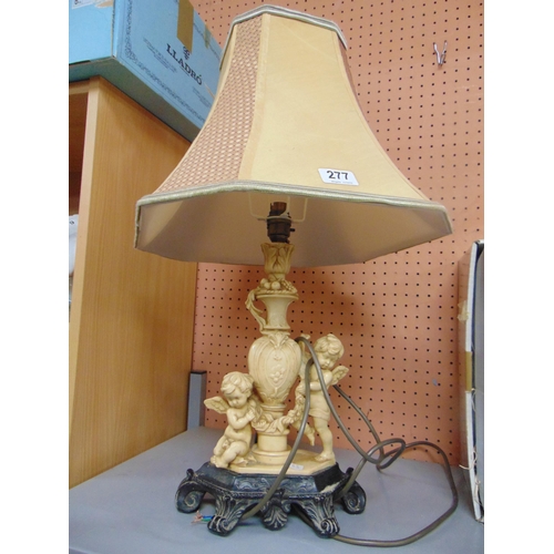 277 - Reproduction table lamp and shade., the base modelled as two cherubs.