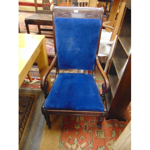 306 - Victorian arm chair, upholstered back and seat, on turned frontal supports.