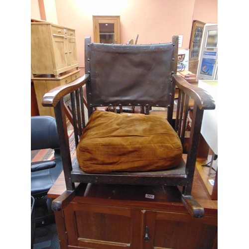 321 - An oak framed child's rocking chair.