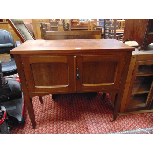 322 - Mahogany washstand , pair of doors, and on tapered supports with castors. 31 x 34 x 16