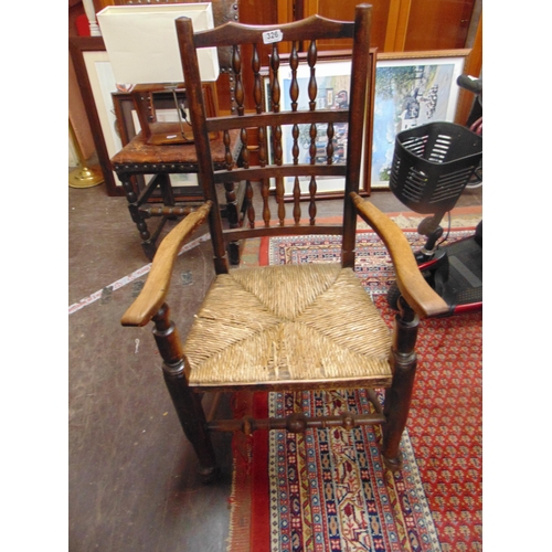 326 - Country made spindle back arm chair, basket weave seat , on turned supports and stretchers.