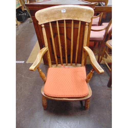 329 - Beech and Elm farmhouse chair, rail back , open arms , solid seat on turned supports and stretchers.