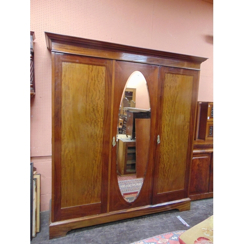 341 - Late Victorian inlaid mahogany triple door wardrobe, ogive cornice above oval mirror centre , flanke... 