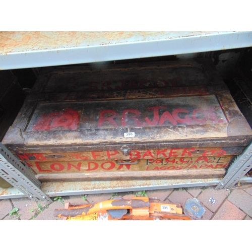 396 - Antique pine metal bound travel trunk, having lift up lid and side handles.