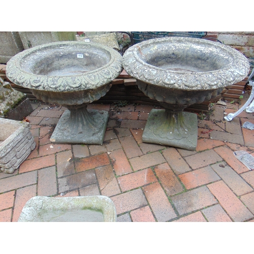 412 - Pair of stoneware garden urns on stands, each 20