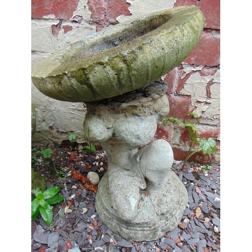 415 - Stoneware garden bird bath, having cherub form base. 16