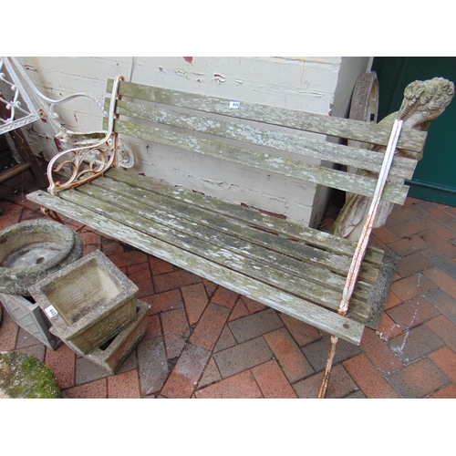 446 - Wooden slatted garden bench, having shaped metal ends, 47