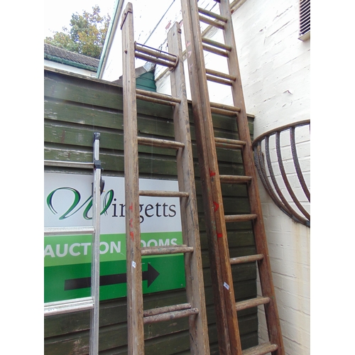 453 - Set of extending wooden ladders.