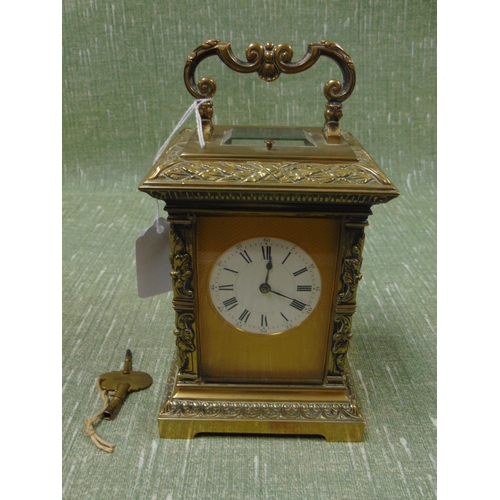 1 - Good  French antique brass cased carriage clock, having embossed decoration, enamel face and Roman n... 