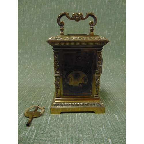 1 - Good  French antique brass cased carriage clock, having embossed decoration, enamel face and Roman n... 