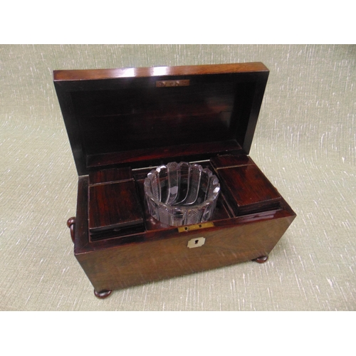 141 - Good 19th century rosewood tea caddy, of sarcophagus form, lift up lid, fitted interior, ring handle... 