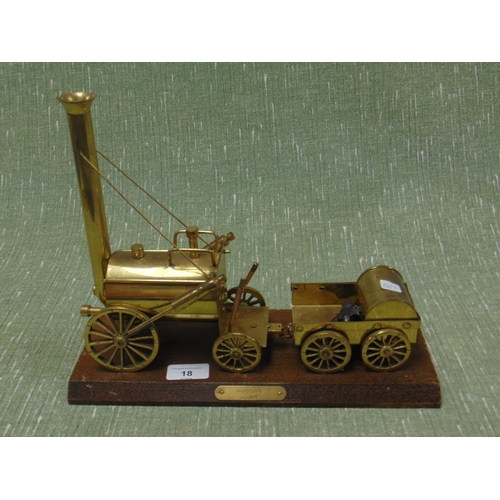 18 - Brass model of Stevenson's  Rocket, set on wooden base. 11 x 12