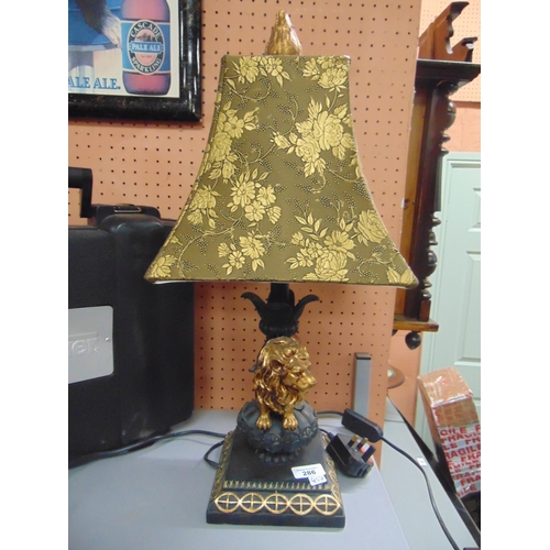 286 - Reproduction resin table lamp and shade, the base in the form of a Lion. 22