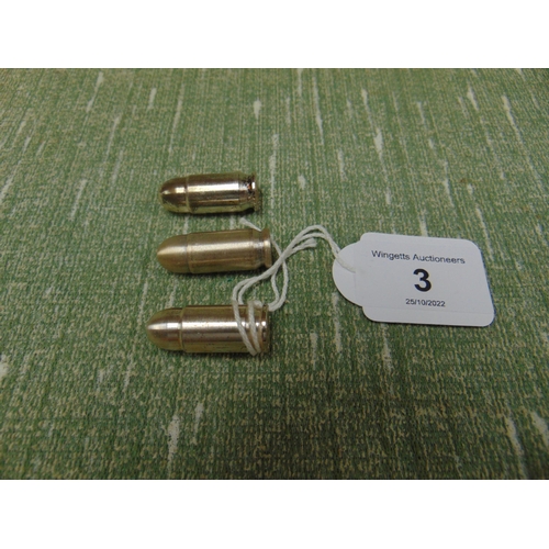 3 - Three silver one Ozt bullets.