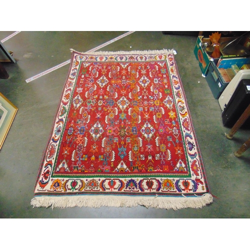 55 - Persian red ground carpet, having geometric pattern. 58 x 41