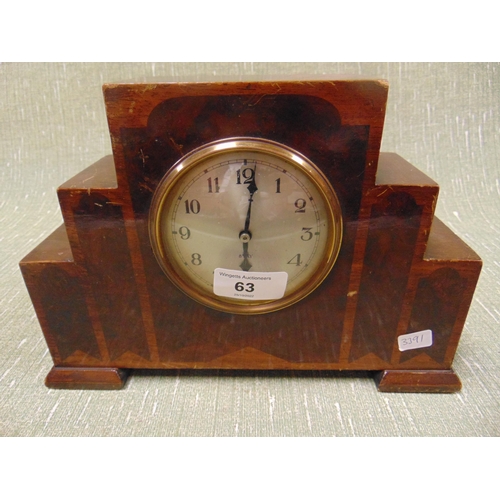 63 - Art deco walnut veneered mantle clock, of stepped form and having Arabic numerals.