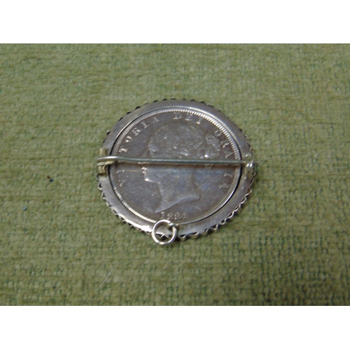 191 - Silver Victorian brooch, in mount containing a 1884 Halfcrown.