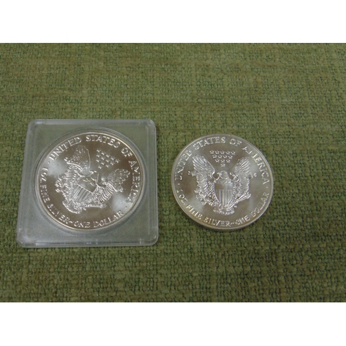 21 - Two United States of America 0z fine silver one Dollar coins, 1987.