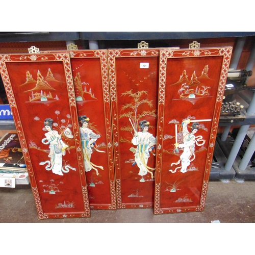 221 - Four reproduction oriental lacquered panels, having moulded figural decoration , each 36 x 12