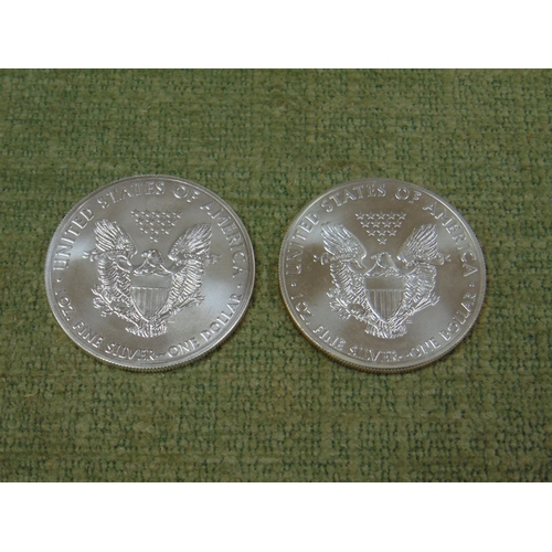 25 - Two United States of America 10z fine silver dollars, 2015.