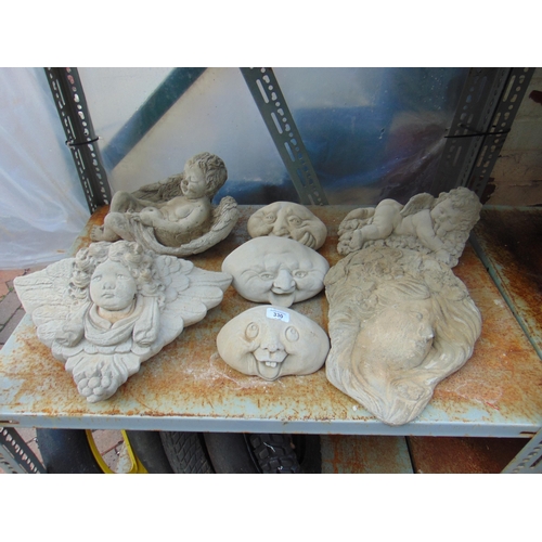 330 - Two modern stoneware garden wall pockets, three busts, cherub figure and one other (7).