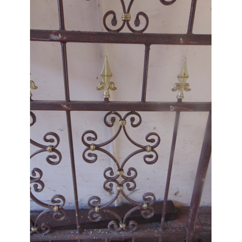 349 - Good pair of cast metal gates, arched tops, shaped decoration with posts and attachments. The gates ... 