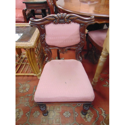 466 - Antique mahogany side chair, having upholstered back and seat, on turned frontal supports.