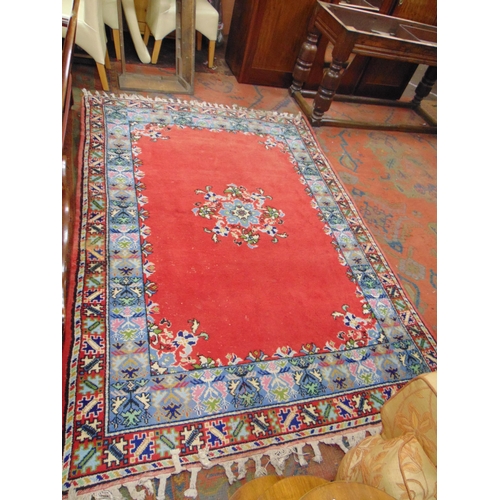 471 - Persian red and blue ground floral rug. 98 x 68