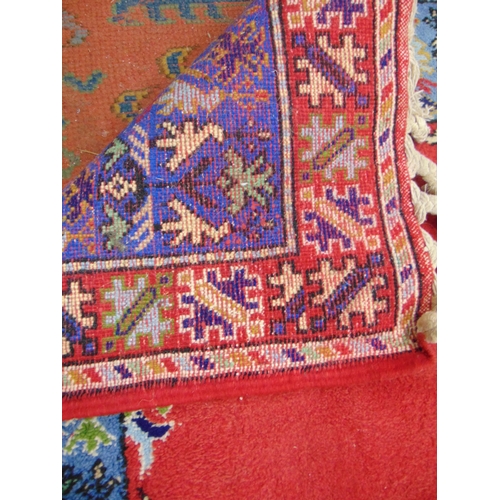 471 - Persian red and blue ground floral rug. 98 x 68