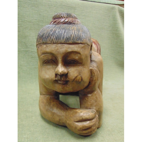 65 - Reproduction hardwood figure, modelled as a kneeling child. 11 x 17