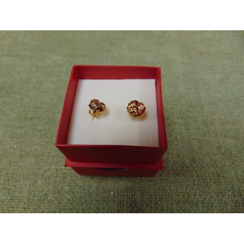 19 - Pair of 9ct gold, knot style earrings.