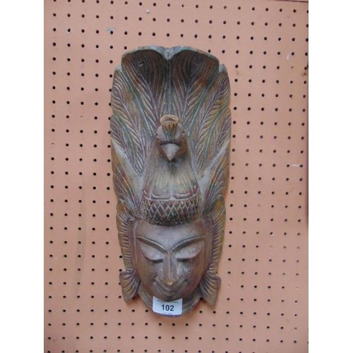 102 - Carved eastern wall mask.