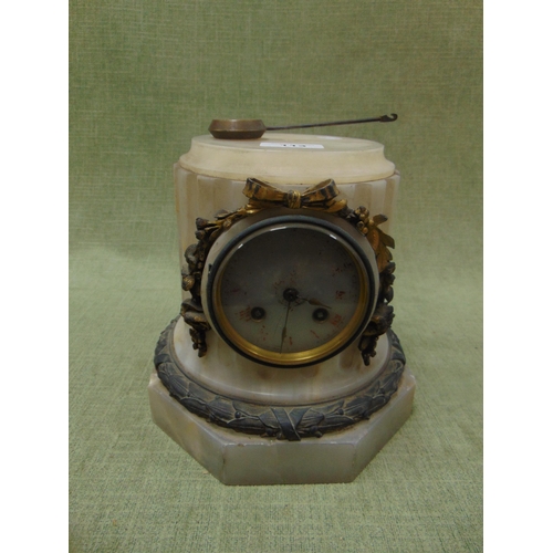 113 - Antique alabaster column form mantel clock. Having applied gilt moulding. 8