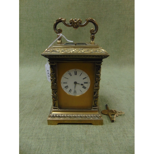 133 - Good  French antique brass cased carriage clock, having embossed decoration, enamel face and Roman n... 