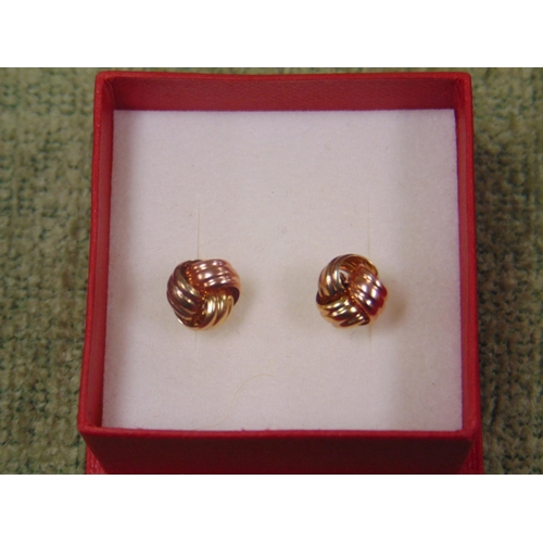 19 - Pair of 9ct gold, knot style earrings.