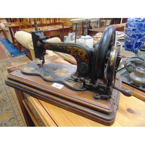 203 - Antique Singer manual sewing machine in case.