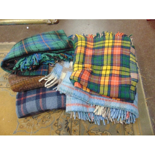 213 - Various tartan blankets.