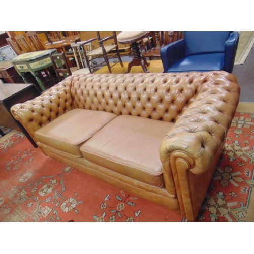 305 - Tan leather button back chesterfield two seater settee. 72