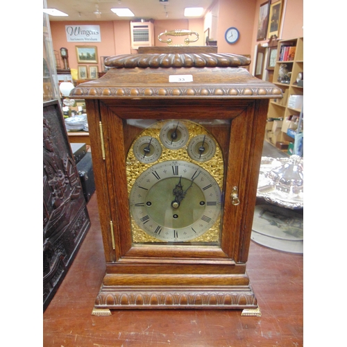 33 - An oak cased bracket clock, having moulded decoration, gilt highlights, three train movement strikin... 