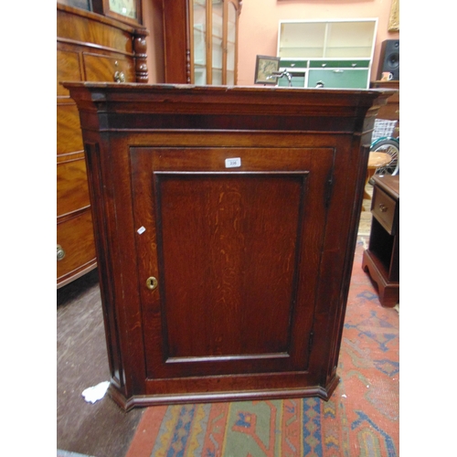 336 - 19th century oak corner cupboard, moulded cornice, single beaded panel door enclosing a shelf lined ... 